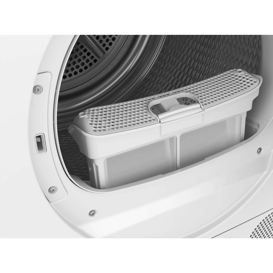 Close up of the lint filter inside a white heat pump dryer