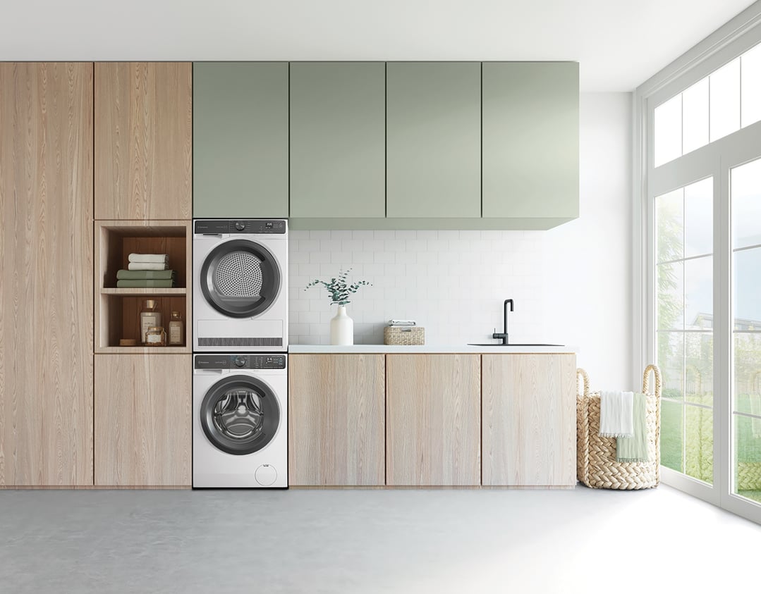 Two white Westinghouse dryers stacked in a modern laundry room