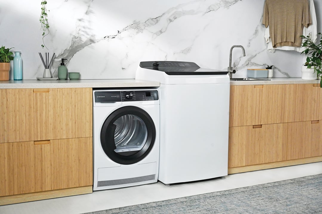 Westinghouse top load washing machine and dryer in a modern laundry room