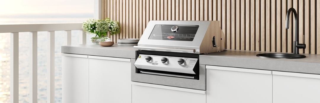 A beefeater BBQ in an alfresco kitchen by the water.