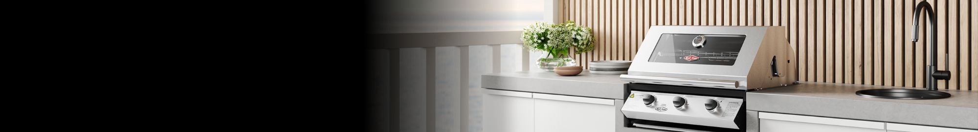 A beefeater BBQ in an alfresco kitchen by the water.